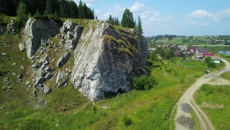 rocky hillside with village view