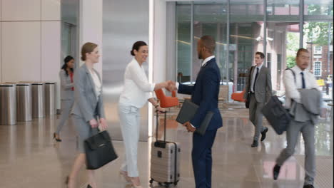 multi ethnic business people meeting in corporate lobby