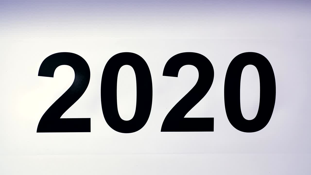 Illustration, new year, male hand put on the table on Canadian flag, country ball, 2020