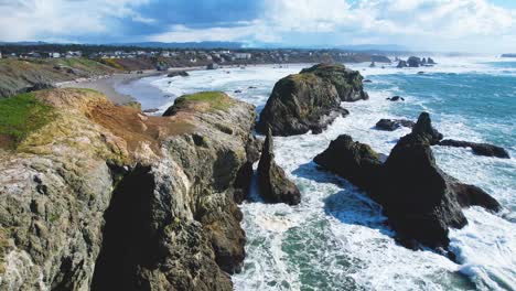 beautiful 4k aerial drone shot moving quickly over rocks at bandon beach in bandon, oregon