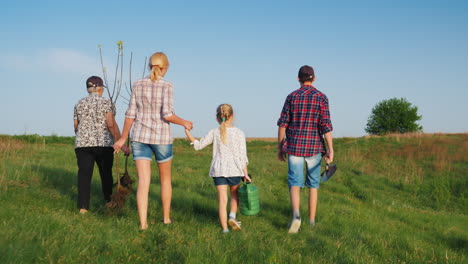 a friendly family is going to plant trees one after another