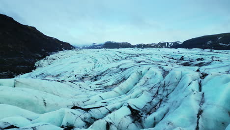 aerial view of lake with ice rocks