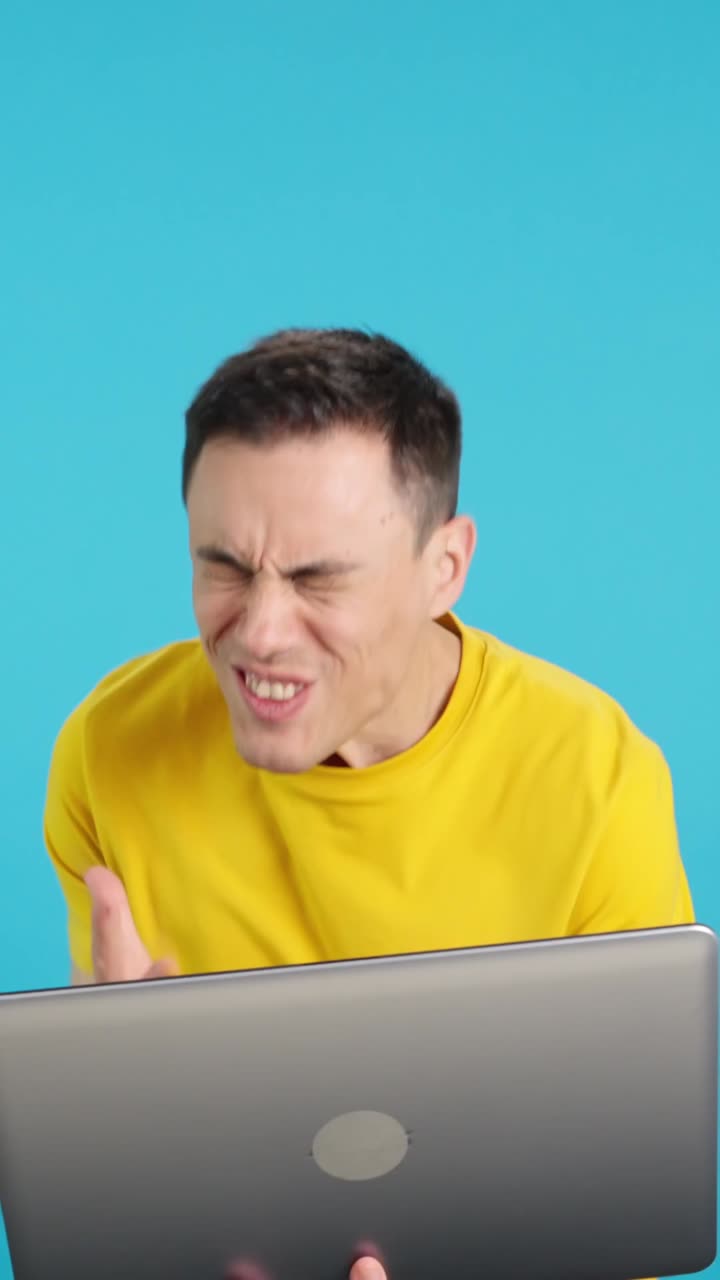 Man looking concerned at a laptop
