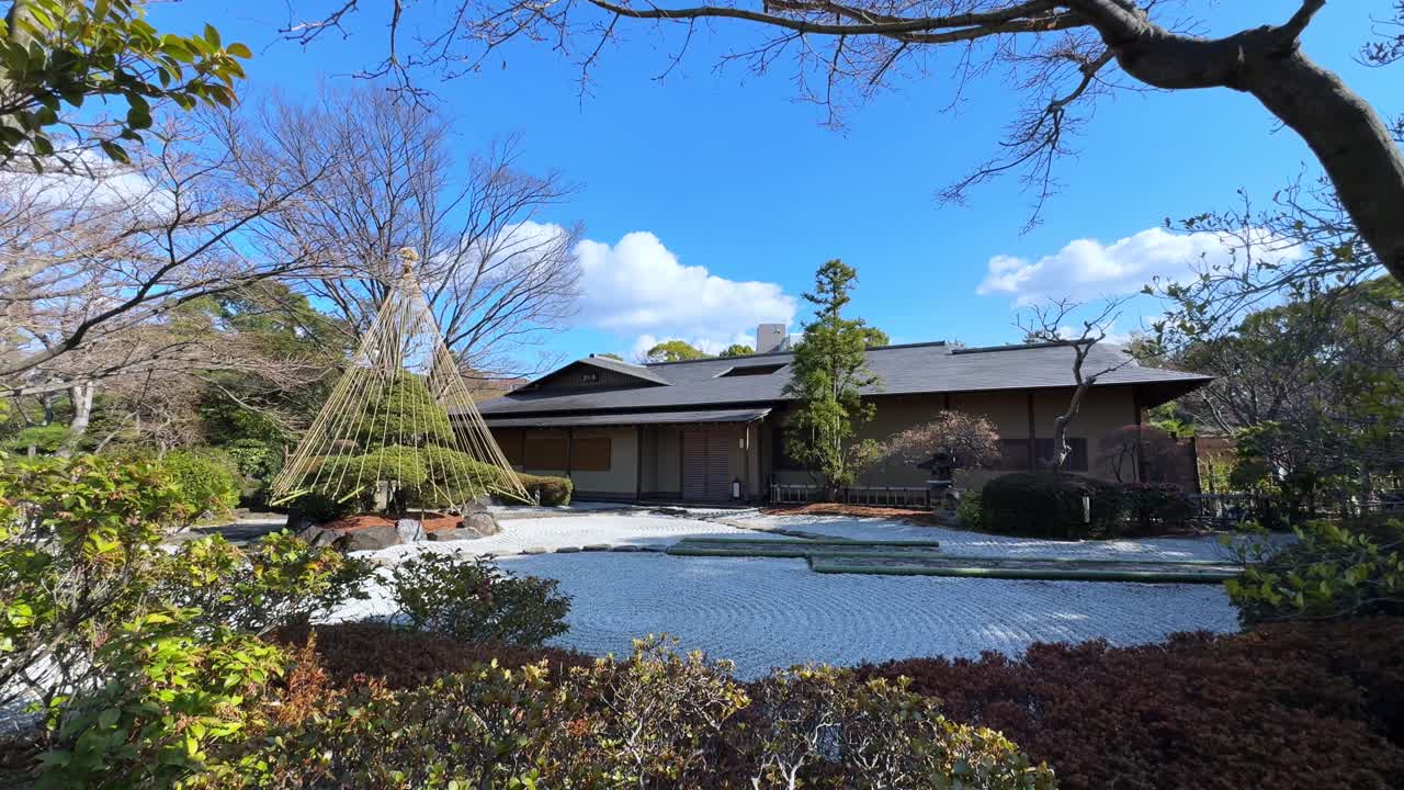 A peaceful Japanese garden with a traditional building, perfect for serene moments