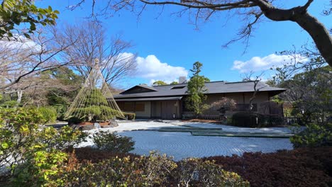 a peaceful japanese garden with a traditional building, perfect for serene moments