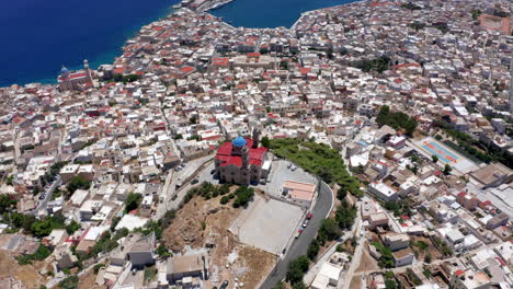 Aerial:-Flying-over-Ermoupoli-city-of-Syros-island,-Greece-on-a-sunny-day