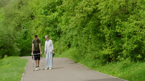 couple with walker in park