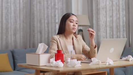 woman taking medication during video call