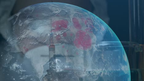 Animation of globe spinning with a filled syringe