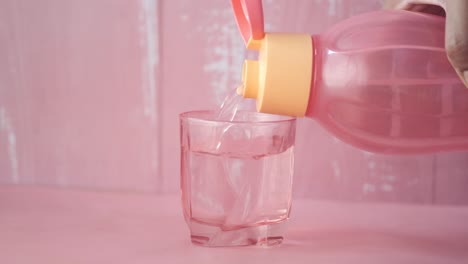 pouring water into a glass