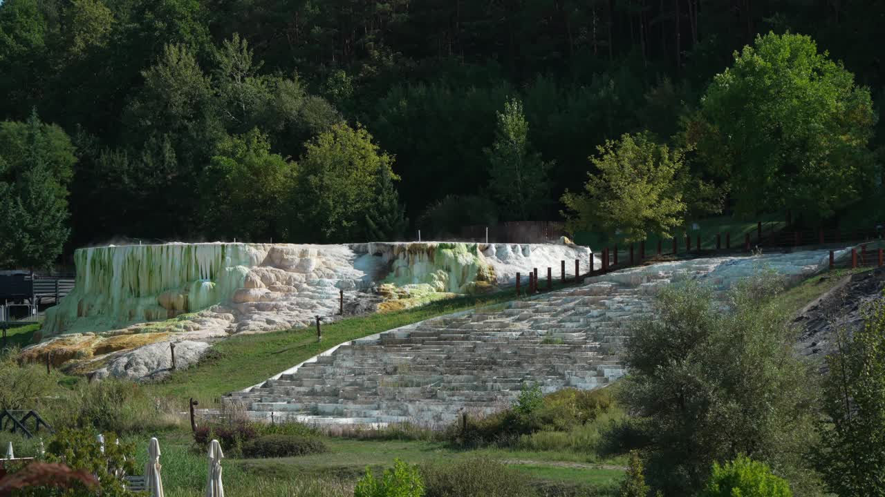 Distant view from the steaming, colorful salt hill in Egerszalók, Hungary on a sunny autumn day