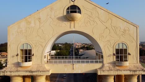 beautiful aerial close-up ascending view of arch 22 monument building at entrance of banjul city gateway, gambia