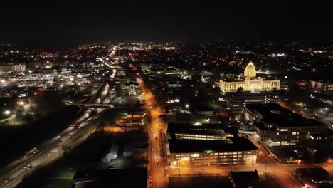 arkansas state capitol building at night in little rock, arkansas with drone video wide shot stable