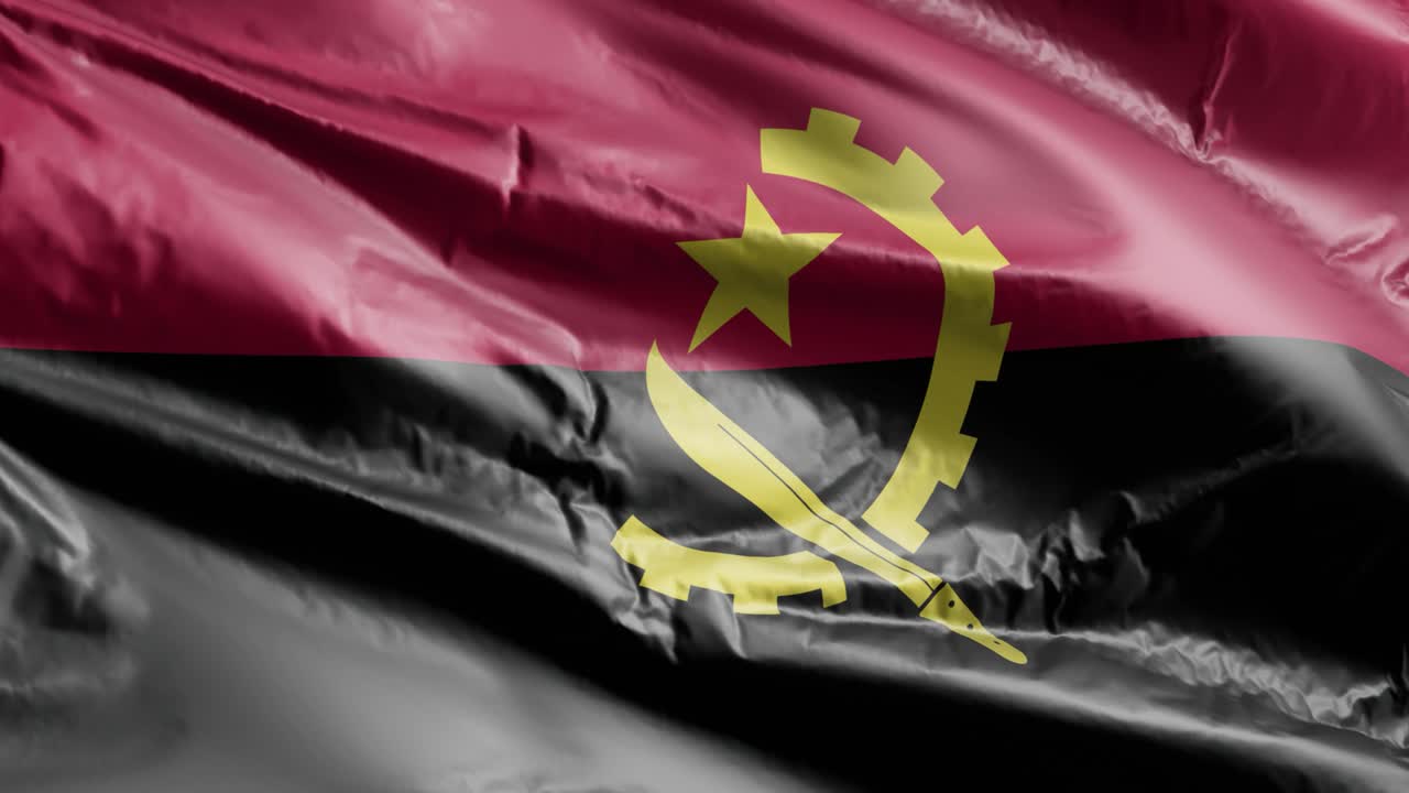 la bandera de angola se agita lentamente en el bucle del viento. la bandera angoleña se balancea suavemente en la brisa. el fondo de relleno completo. bucle de 20 segundos.