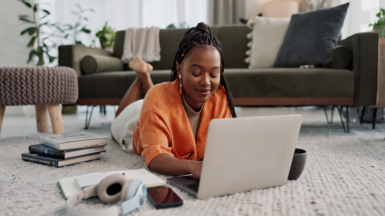 Laptop, smile and woman typing on the floor