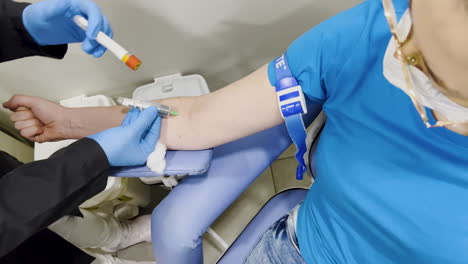 Top-view-capture-of-a-woman-having-her-blood-drawn-for-testing