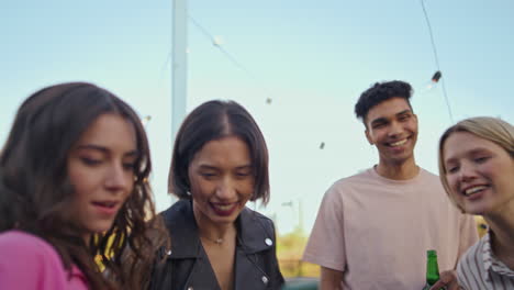 cheerful friends making selfie at party closeup. students partying at rooftop
