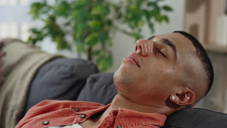 man sleeping on a couch
