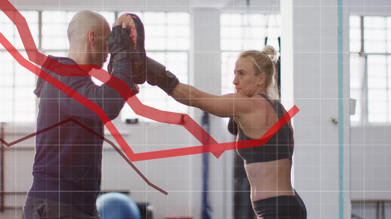 Trainer moving mitts athlete throwing punches ducking and boxing combos with gloves grid red graph