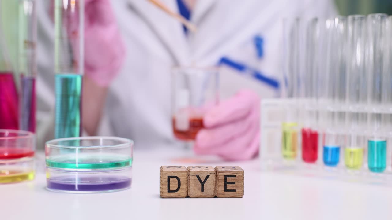 Scientist Working with Colorful Dyes and Chemicals in a Laboratory