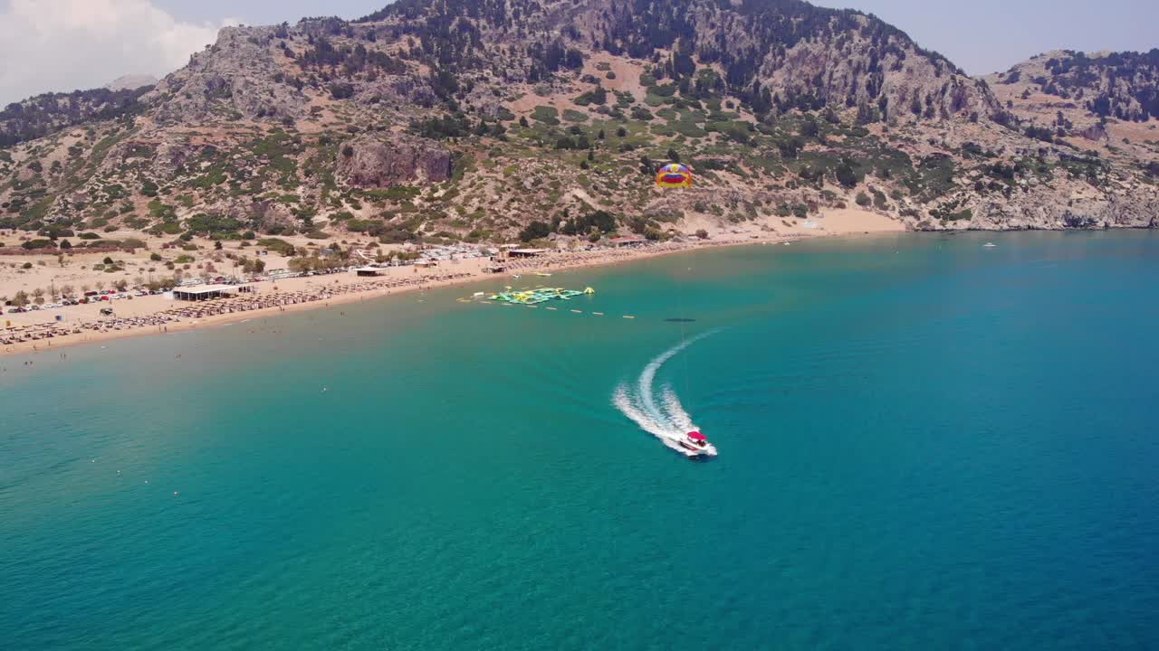 Parasailing And Water Park Summer Adventure At The Tsambika Beach On Rhodes Island In Greece
