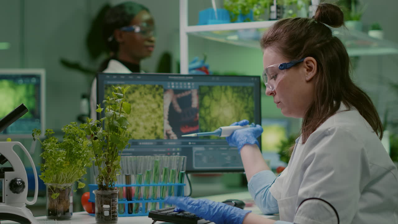 Biologist scientist putting solution liquid in test tube
