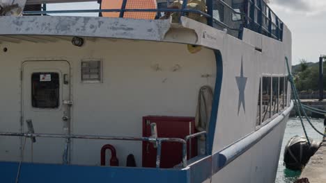 pan shot of a boat parked at a port