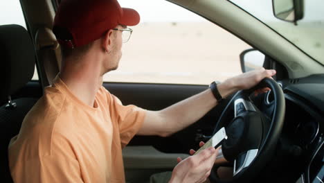 man driving car