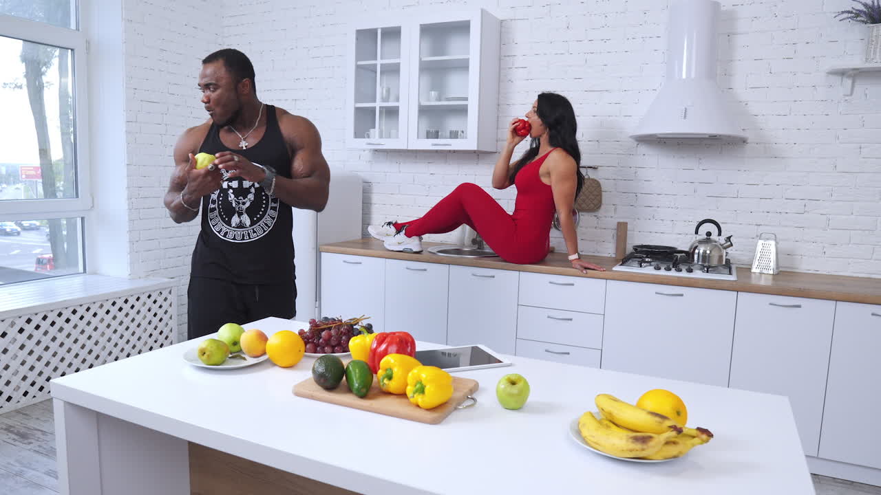 Couple enjoying healthy food in the kitchen