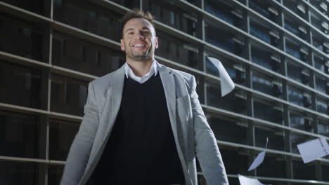 businessman throwing documents on city street. business man walking on street