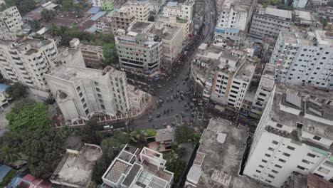 city intersection traffic full of three wheelers aerial view