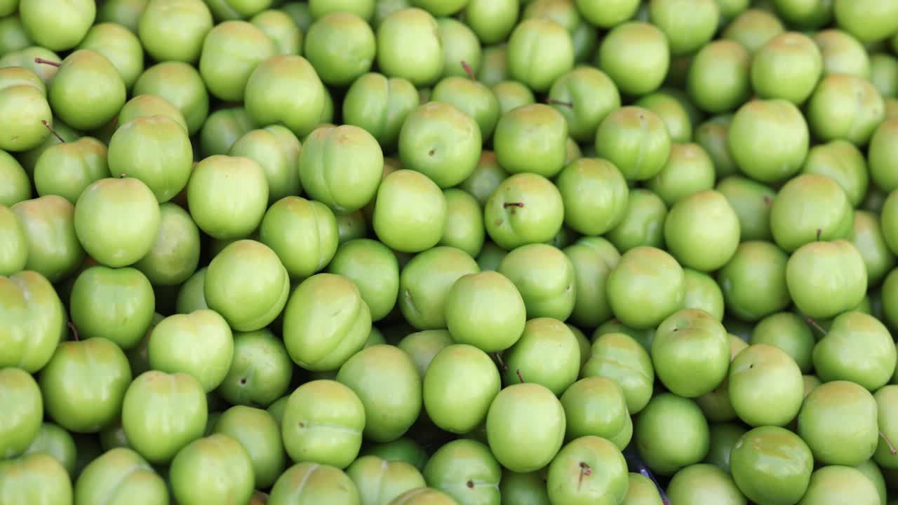 Pile of green plums
