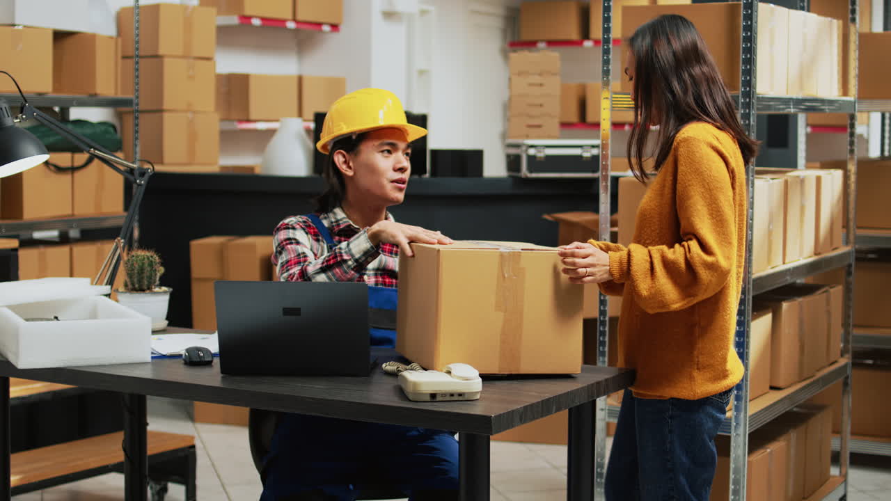 Warehouse workers handling boxes in a storage facility