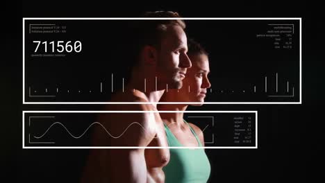 animation of interface with data processing over caucasian fit couple against black background