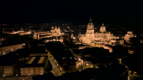 orbit shot at night time of beautiful church in heart of salamanca city, spain