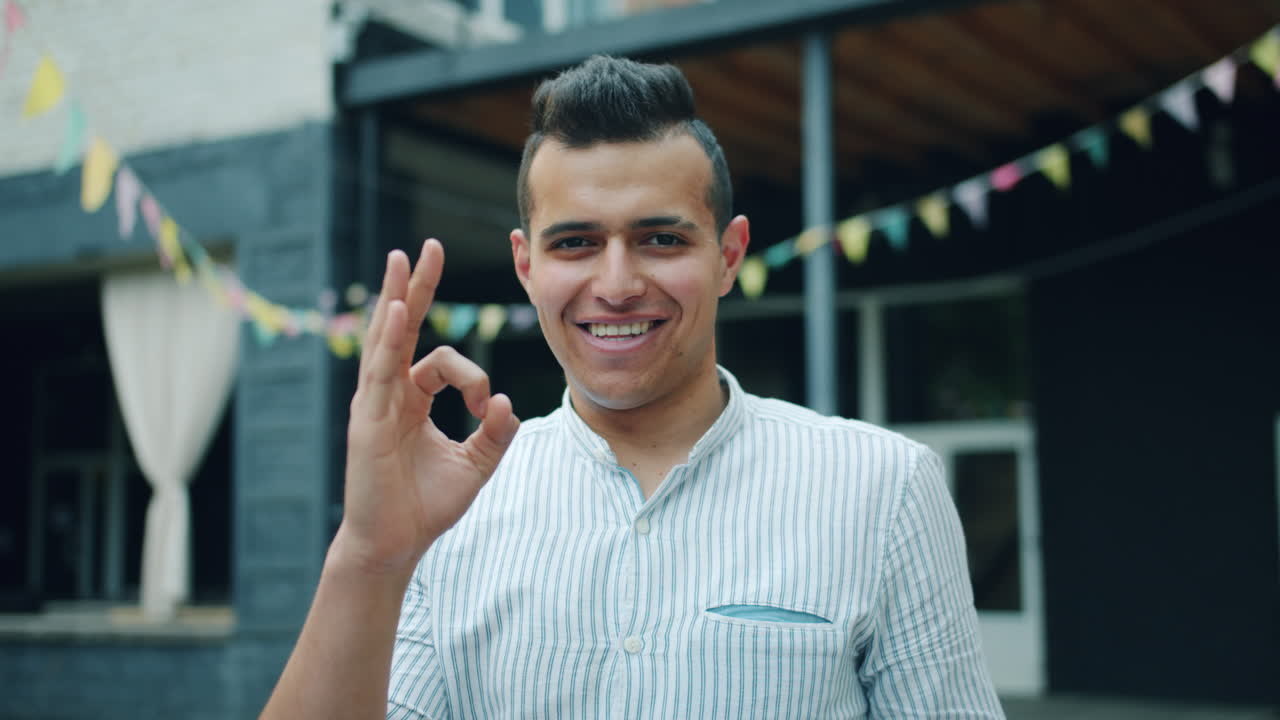Happy Man Showing Okay Gesture