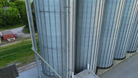 Grain-Silos---Set-Of-Storage-Tanks-In-Farm---drone-shot