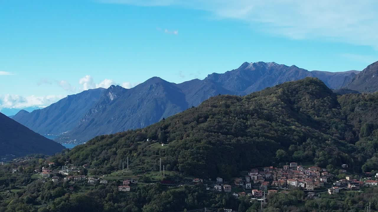 Stunning aerial view of the Alps and charming Italian village in nature