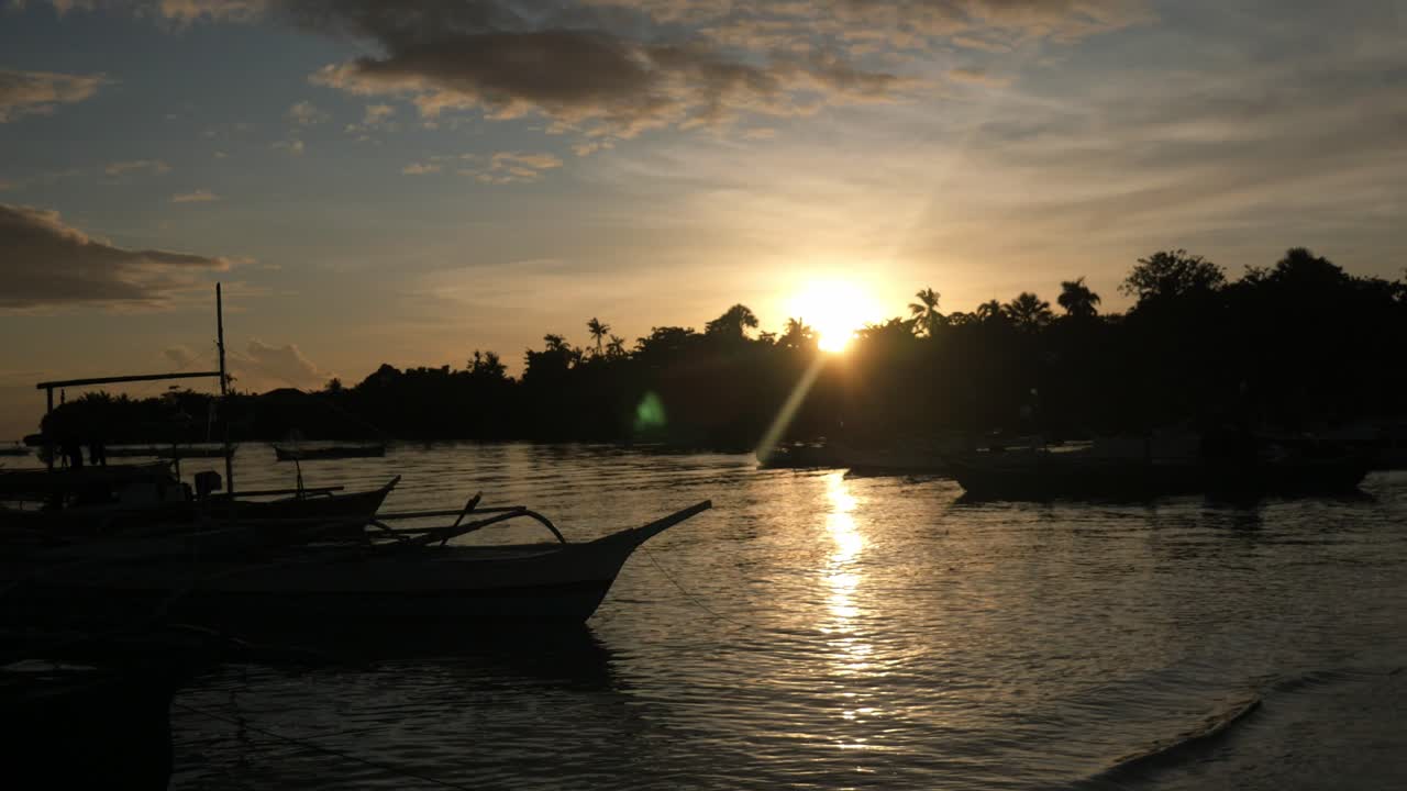 Traditional Bangka Boats Anchored at the Beach in Bantayan Island in the Evening During Sunset, Cebu, Philippines