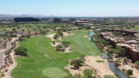 Stunning-aerial-drone-shot-gliding-over-an-immaculate-golf-fairway