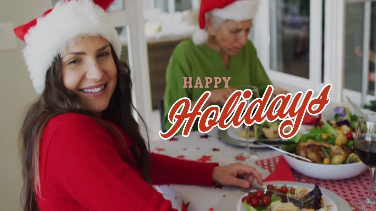 산타 모자를 입은 백인 가족에 대한 해피 크리스마스 텍스트의 애니메이션