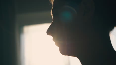 silhouette-of-woman-using-inhaler-to-relief-asthma-in-room