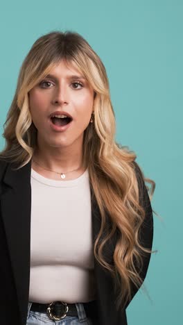 amazed transgender businesswoman screaming as she celebrates success