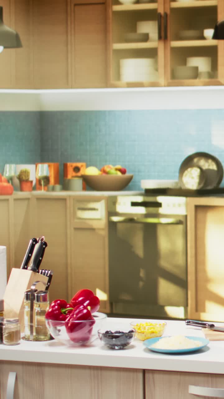 Vertical Video Empty cozy kitchen with a pizza prep area ready for cooking on the isle