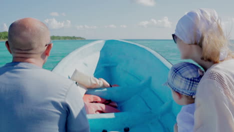 family traveling by boat on high speed