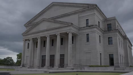 medium pan: stormy skies over the mississippi state supreme court building. jackson, ms