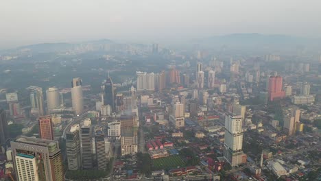 kuala lumpur at sunrise, aerial view of downtown buildings and  city skyline, malaysia.