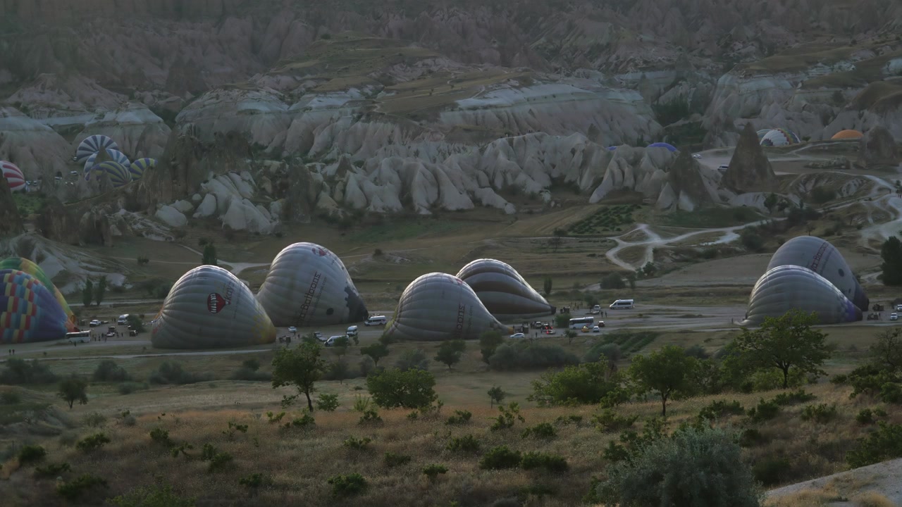 Hot Air Balloons Preparing for Flight in Cappadocia at Dawn