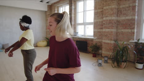 joyous afro couple having dance class with female instructor