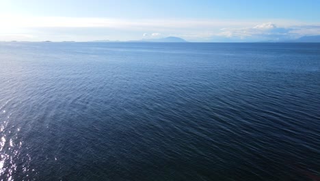 smooth aerial footage in 4k of the calm salish sea at neck point park in nanaimo, bc